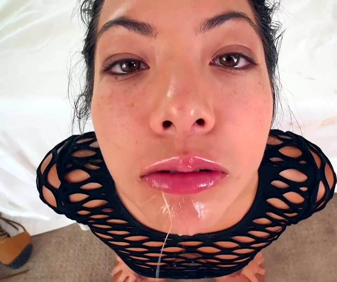 Loving every drop of cum coating her face